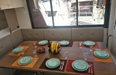 5_eagle-bali-dining-table Superychts For Sale. - Eagle Bali 4.8 Catamaran Charter | Luxury Family Sailing Greece